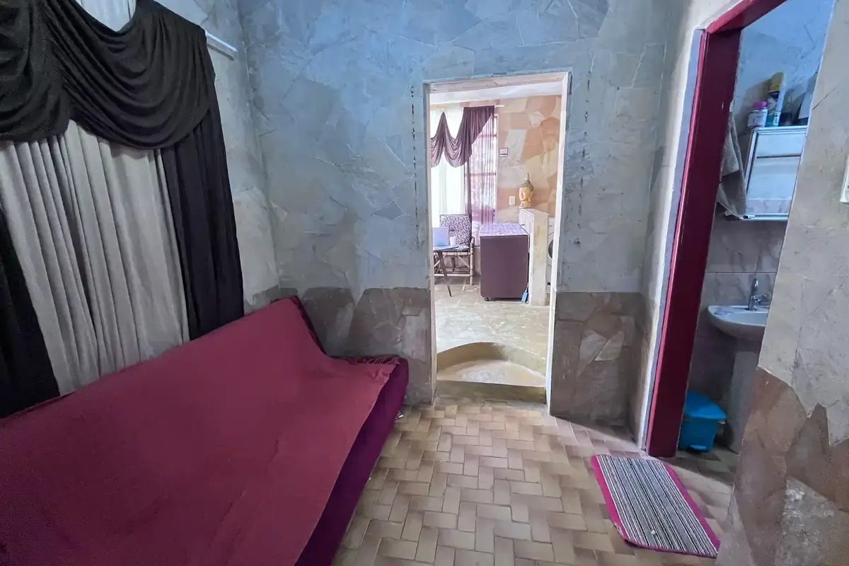 Sala com sofá-cama da Casa de Temporada